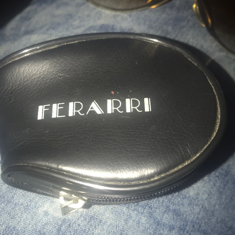 Vintage Ferrari glasses  brown with gold trim.